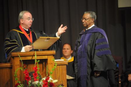 President Dockery installs Roland Porter as the director of the Center for Racial Reconciliation during fall convocation. - Photo by Morris Abernathy