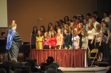 Chris Mathews leads the University Singers in <em>Hymn of Mercy</em> during fall convocation. - Photo by Morris Abernathy