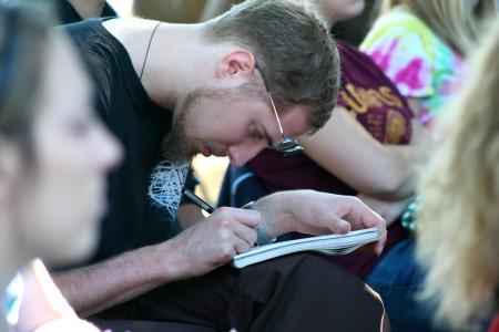 Rob Alsobrook, Union alumni, conducted a sculpture workshop for Union art majors outside the photo house.  Junior art major Chris Malloy took notes during the workshop. - Photo by Kristi McMurry Woody