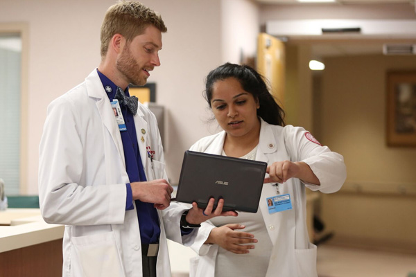 Preceptor working with student