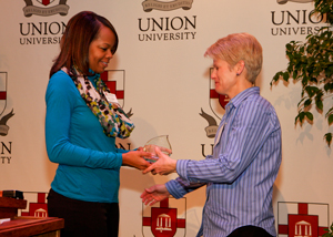 Dr. Michelle Blanton receives a preceptor of the year award.