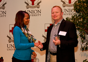 Dr. Kevin Coffer receives a preceptor of the year award.