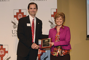 Dr. Marilyn Hutchison receives the 2010-2011 preceptor of the year award.