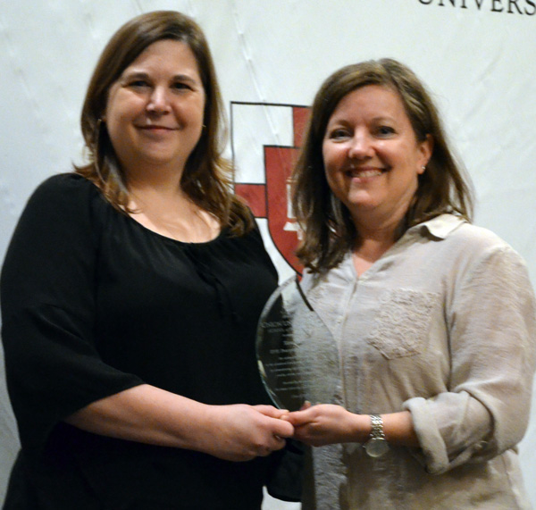 Tara Pratt is presented the 2017 IPPE Preceptor of the Year Award by Kim Lindsey-Goodrich