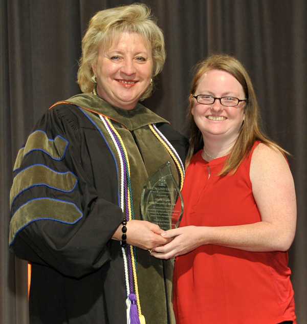 Alydia Snyder is presented the 2017 APPE Preceptor of the Year by Sheila Mitchell