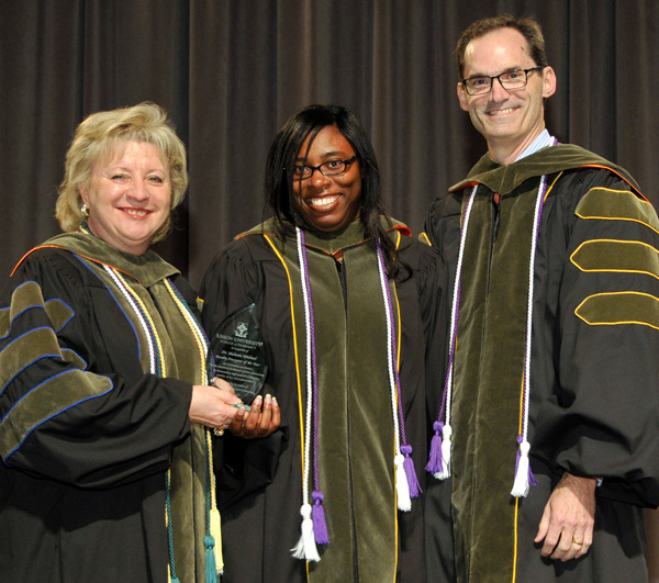 Melanie Michael is presented the 2017 Faculty Preceptor of the Year by Sheila Mitchell and Mark Stephens