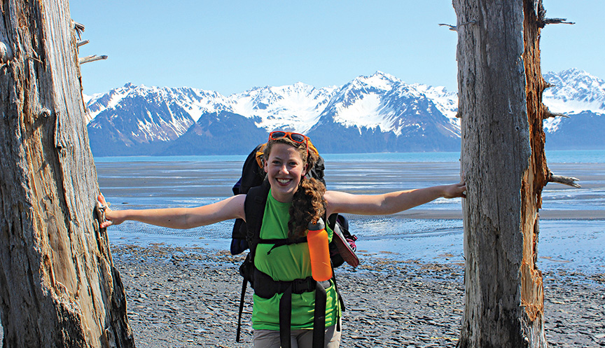 Miracle Burton stands on the beach of Resurrection Bay outside Seward, Alaska.