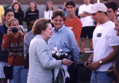 Lady Thatcher greeting students on campus.