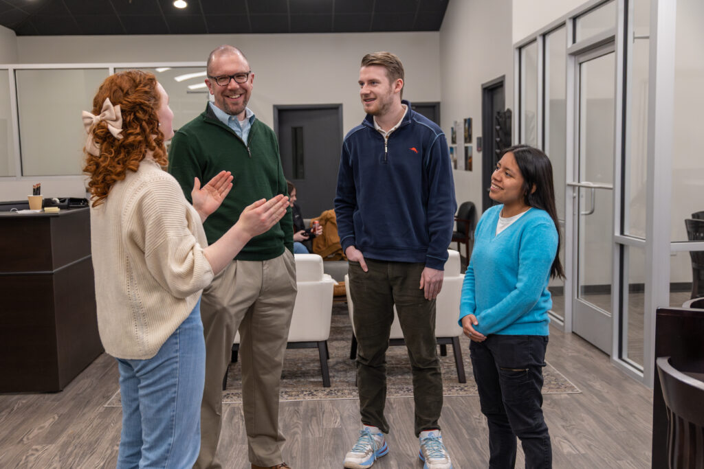Justin Barnard talking with students