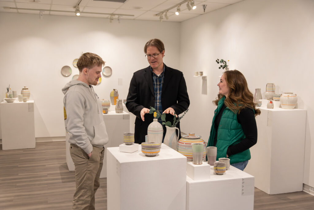 Steve Halla with students in the Art Gallery