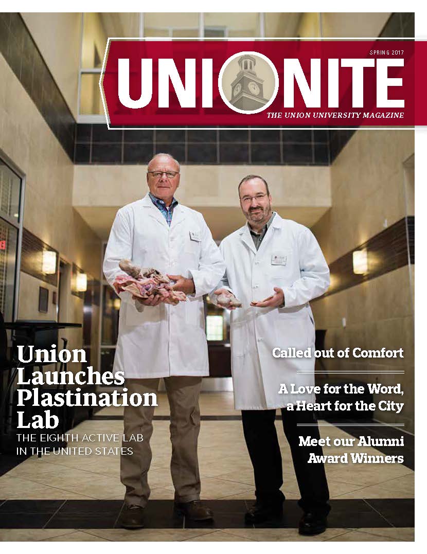 Two men in lab coats stand in a hallway holding anatomical specimens. The magazine cover reads UNIONITE, with headlines about a new plastination lab and various features inside.
