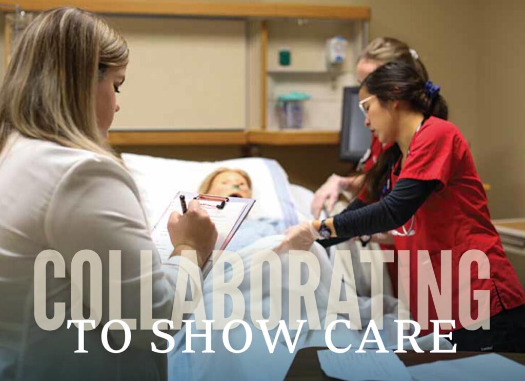 Two healthcare workers in red uniforms assist a patient in a hospital bed while another professional writes on a clipboard, highlighting teamwork. The words Collaborating to Show Care are overlaid on the image.