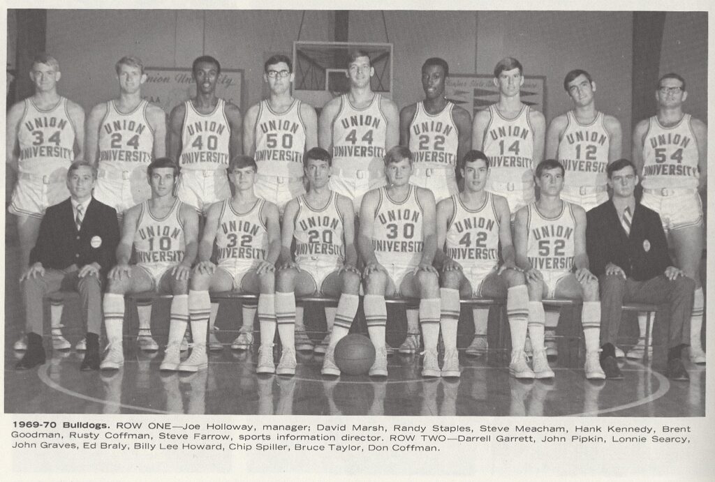 A black and white group photo of the 1969-70 Union University Bulldogs basketball team, a moment captured in the history of Union University, with players and staff posing in uniforms showing numbers and Union University on the front.
