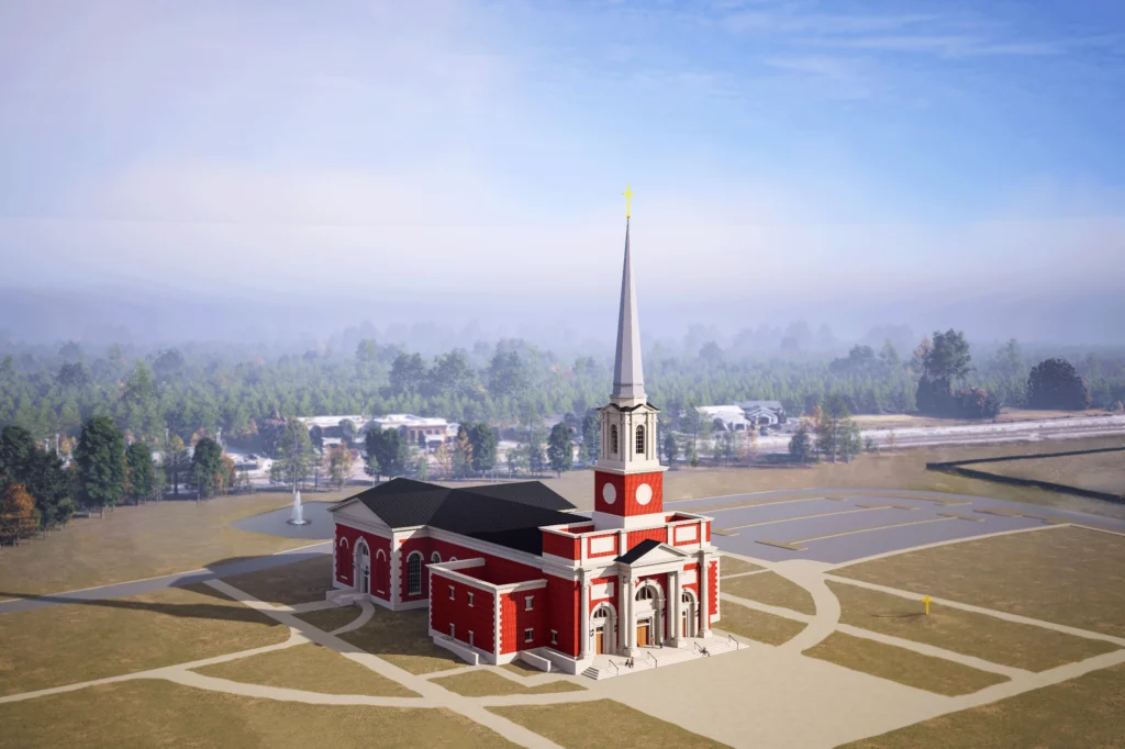 Aerial view of a large red brick church with white columns and a tall steeple, surrounded by paved walkways and a parking lot, with trees and buildings in the background under a partly cloudy sky.