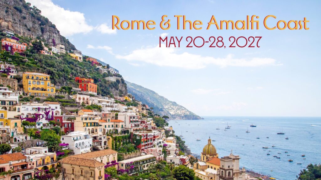 Colorful buildings on a hillside in Sorrento overlook the sea with boats in the water. Text reads Rome & The Amalfi Coast, May 20–28, 2027. A bright sky and lush green areas are visible on the hill.