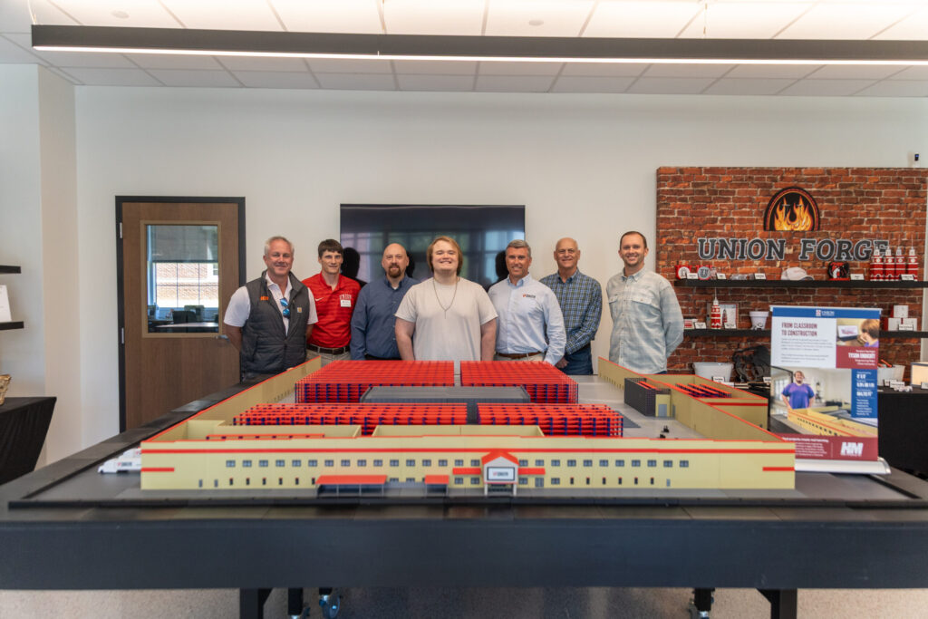 Representatives from Tractor Supply and H&M Construction join Union student Tyson Endicott and professor Georg Pingen for a presentation of the 3D model