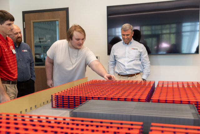 Tyson Endicott points to a 3D model of the new Tractor Supply facility.